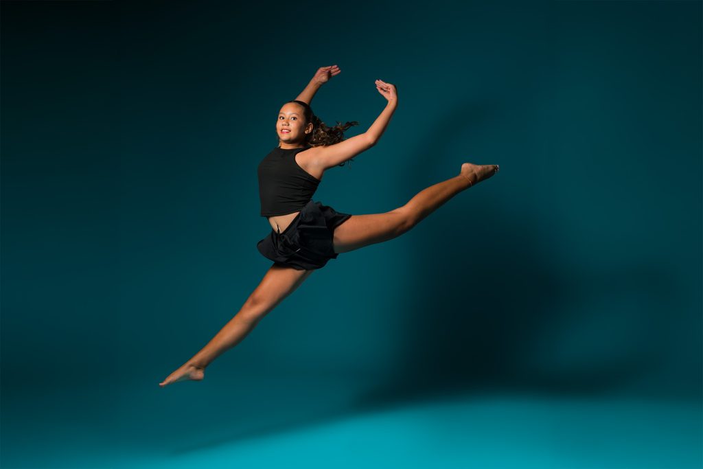 NoraSakota-5-optimized girl leaping into air in dance pose